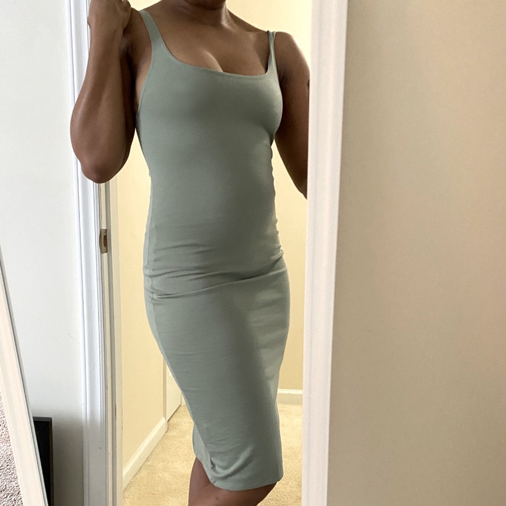 Sage green form fitting knee length dress